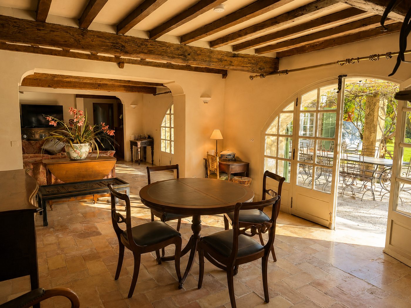 Long dining table and chairs in the main house at Mas des Serres